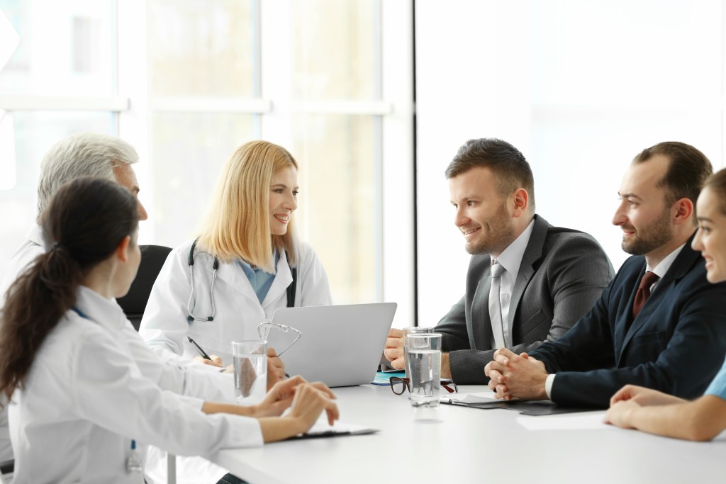 Hospital Value Analysis Committee (VAC) discussing new medical technology